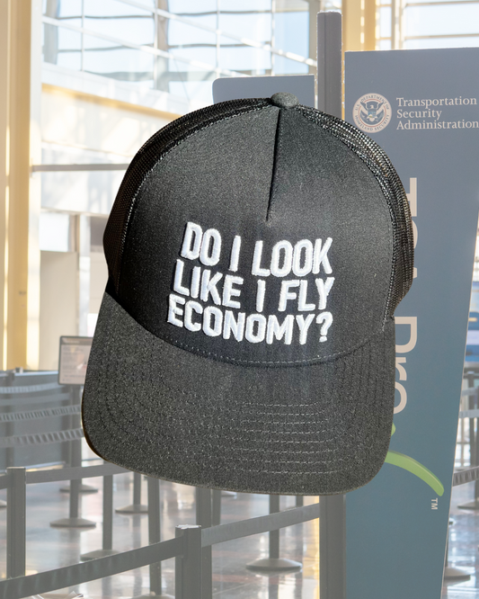 DO I LOOK LIKE I FLY ECONOMY? TRUCKER