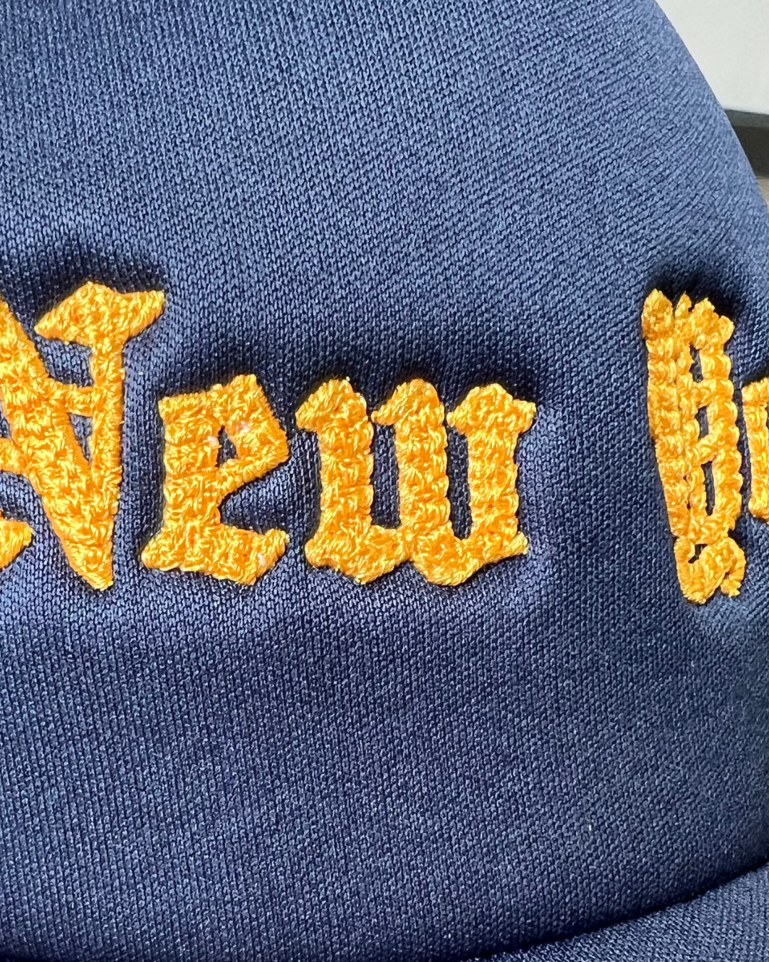 Navy Chainstitch New York Curved Bill Trucker