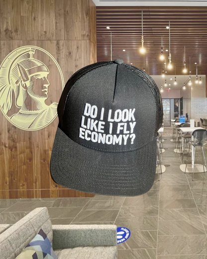 DO I LOOK LIKE I FLY ECONOMY? TRUCKER