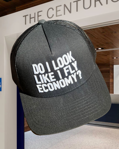 DO I LOOK LIKE I FLY ECONOMY? TRUCKER